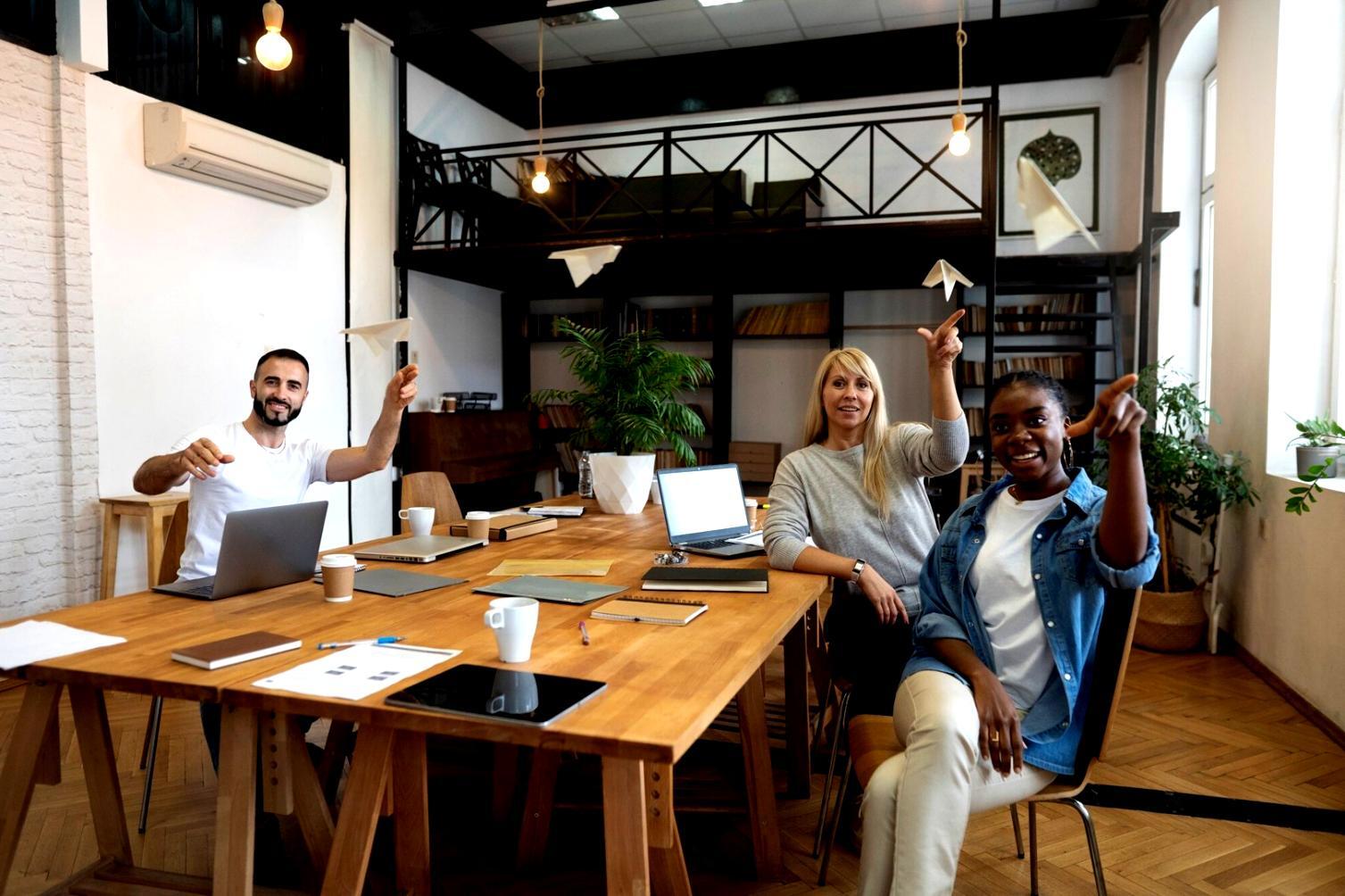 Person reviewing their weekly budget with calculator and notebook on desk